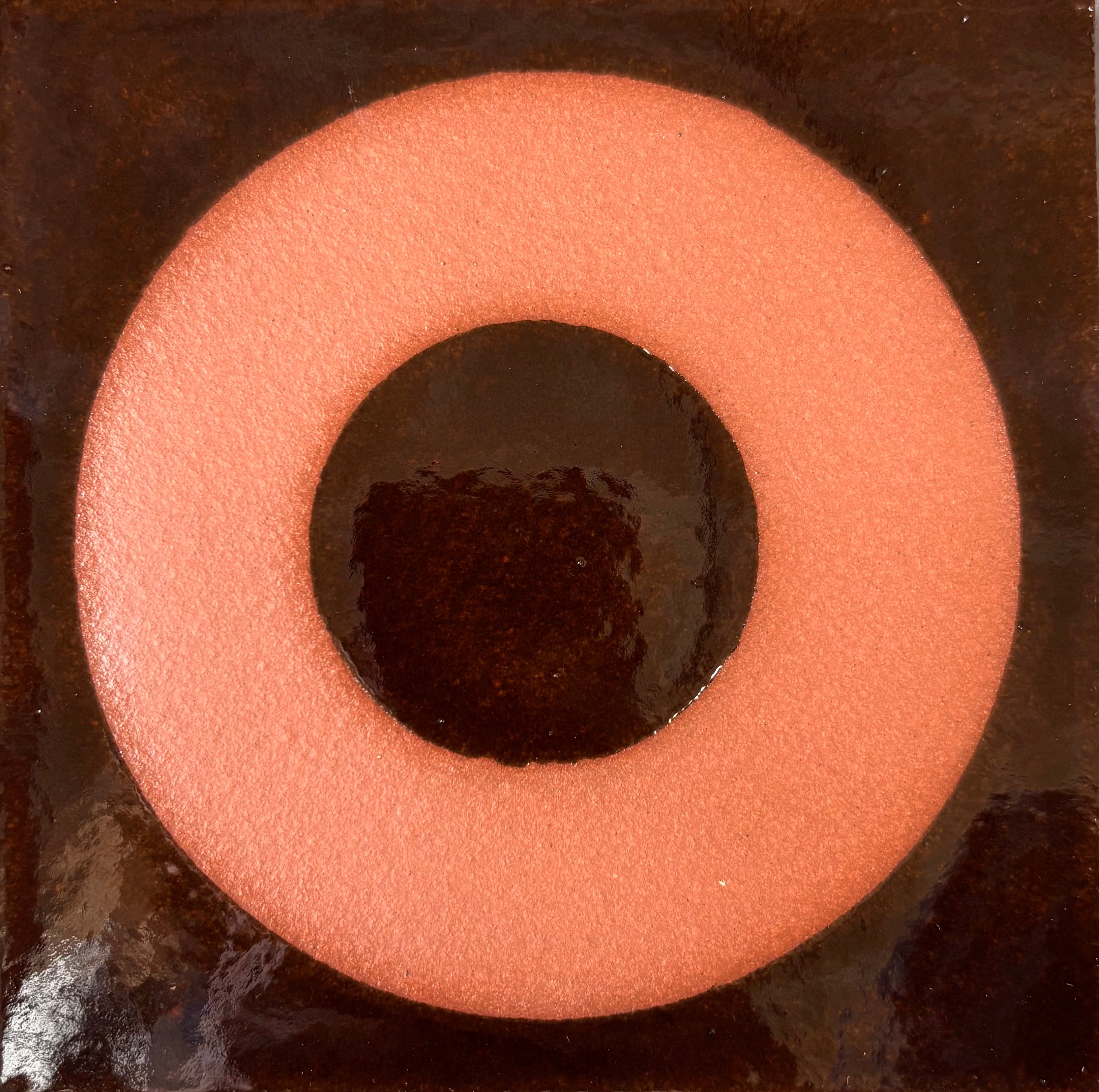 Abstract art with concentric circles in brown and black