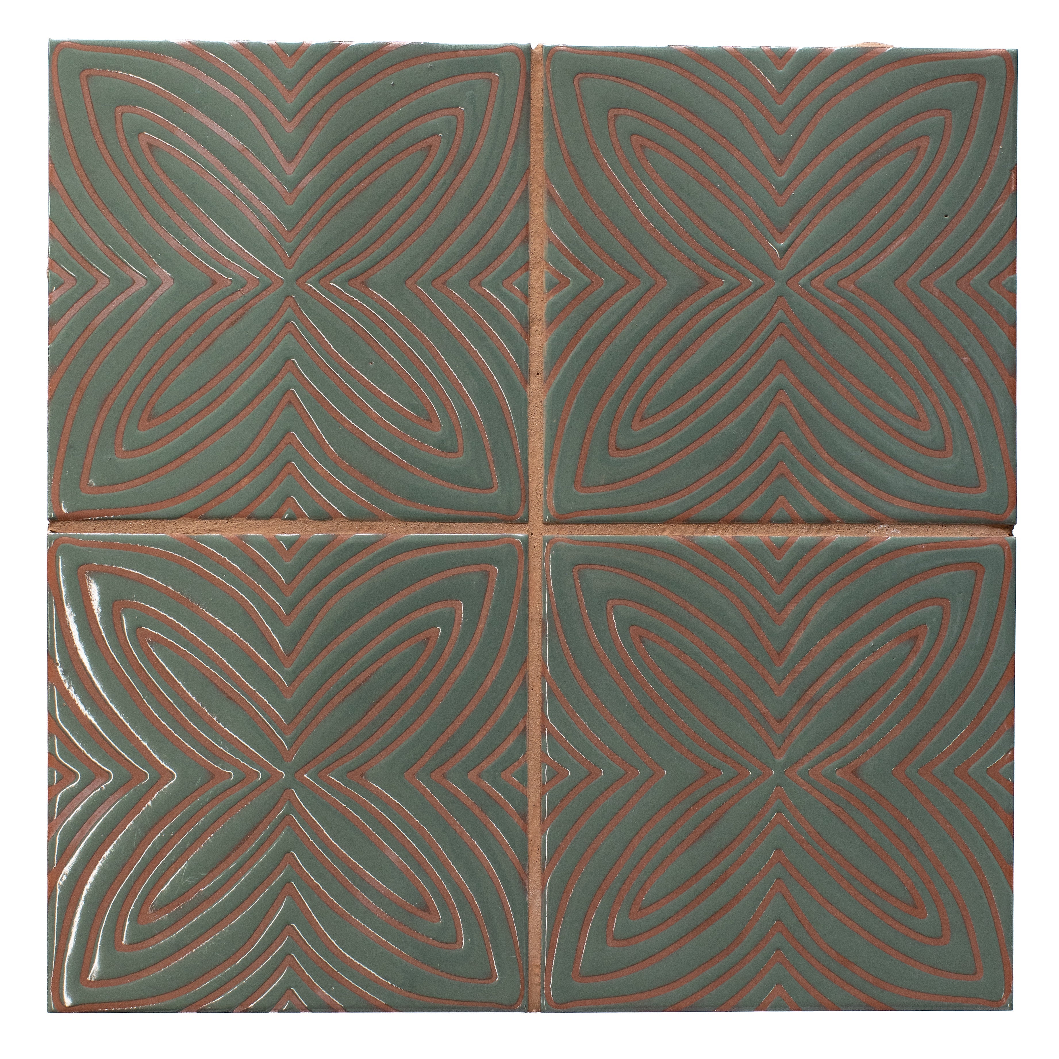 Four green tiles with red geometric patterns arranged in a grid.