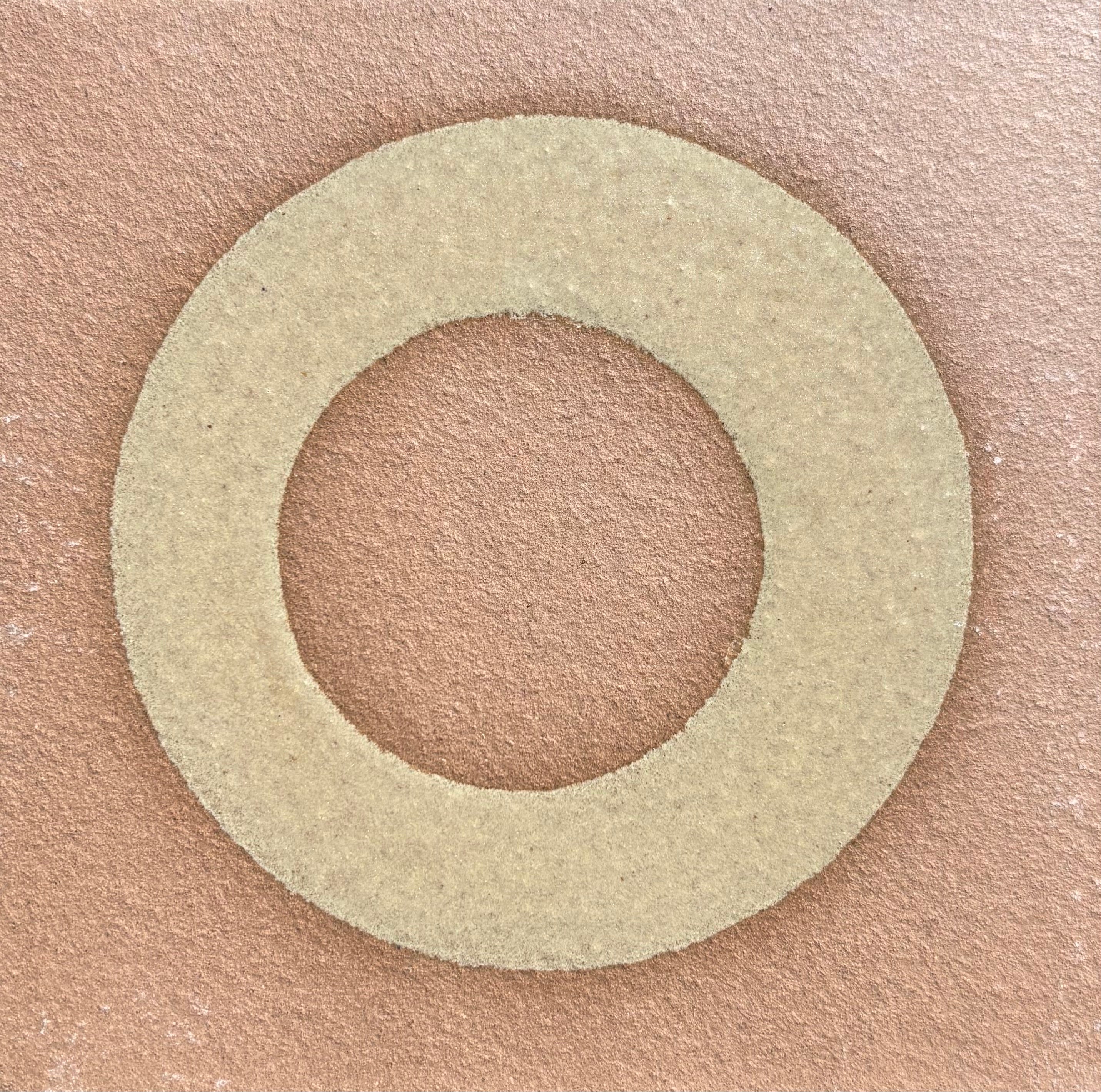 Round beige glaze on a beige background